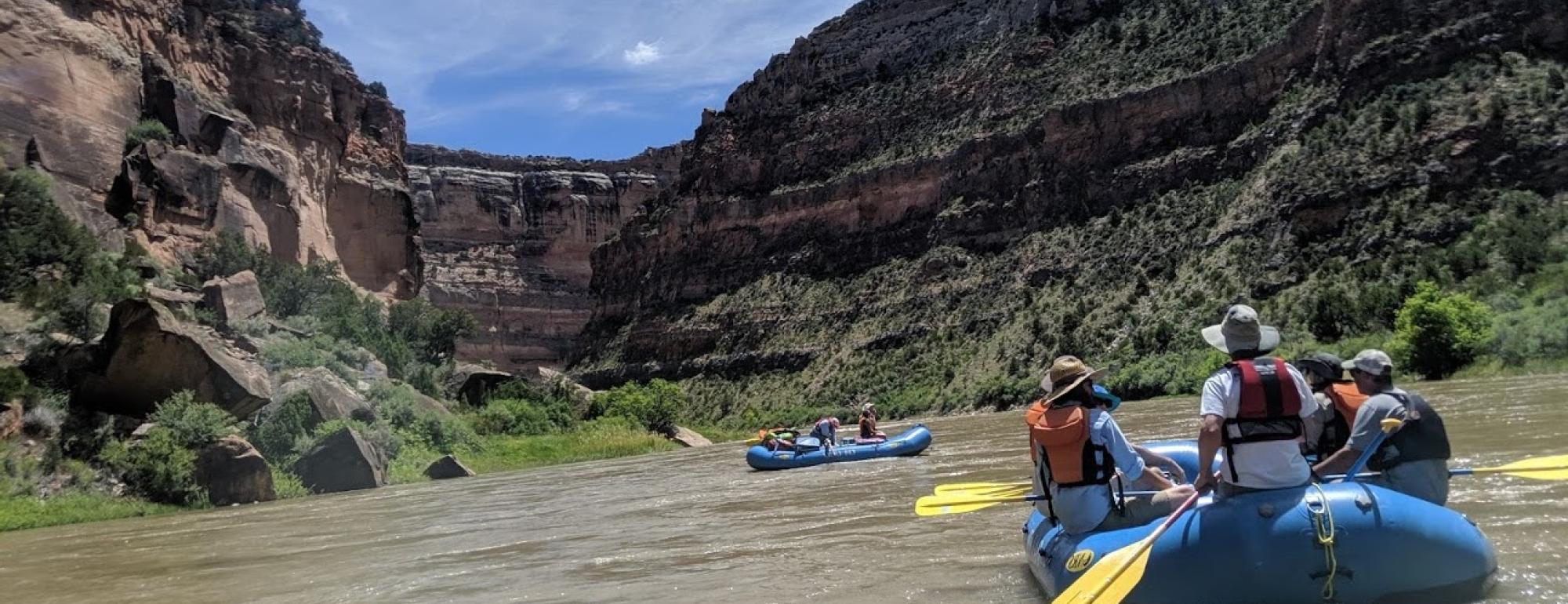 Students rafting down a river